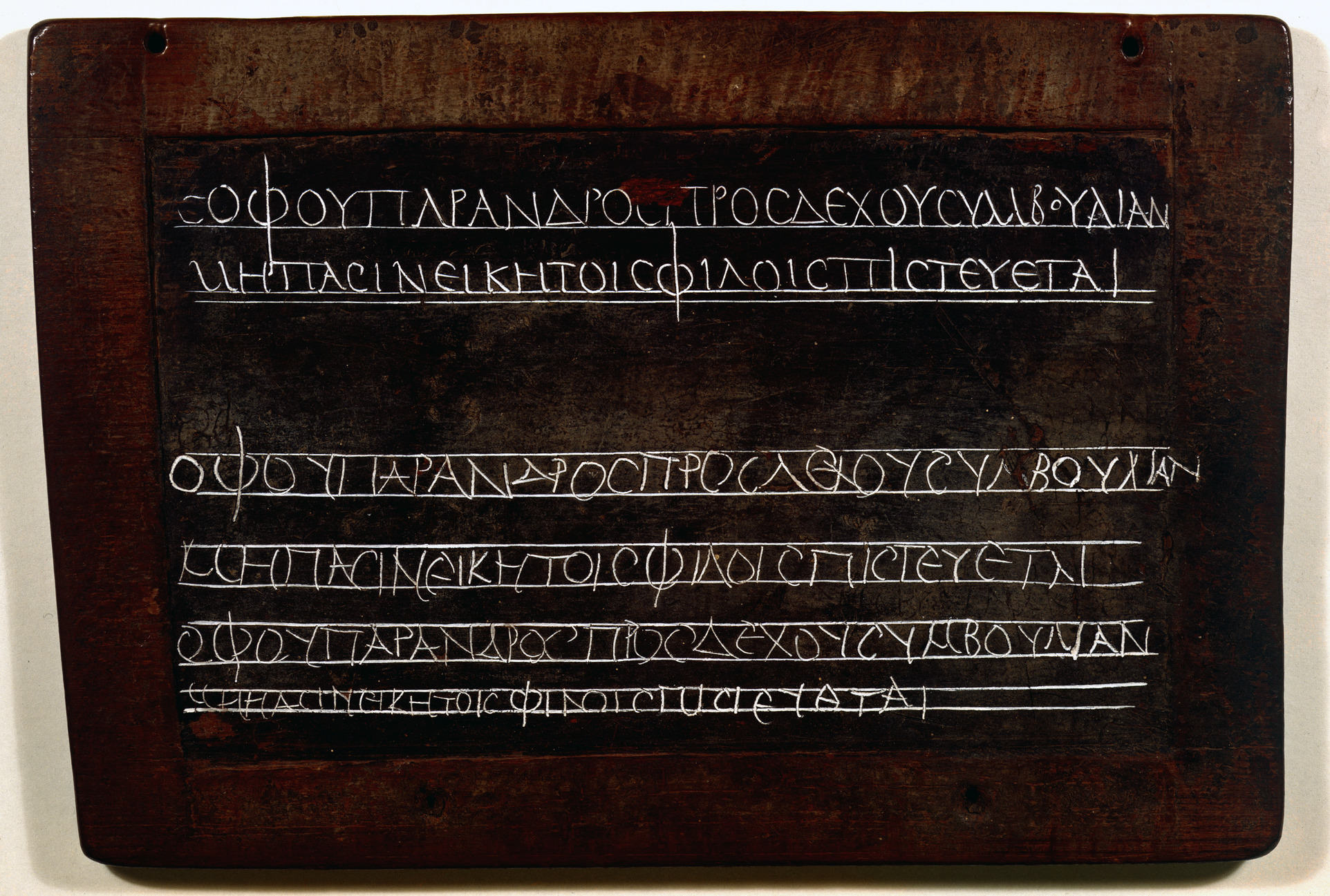 Second-century wax tablet from Egypt with a teacher's model lines and a pupil's copies